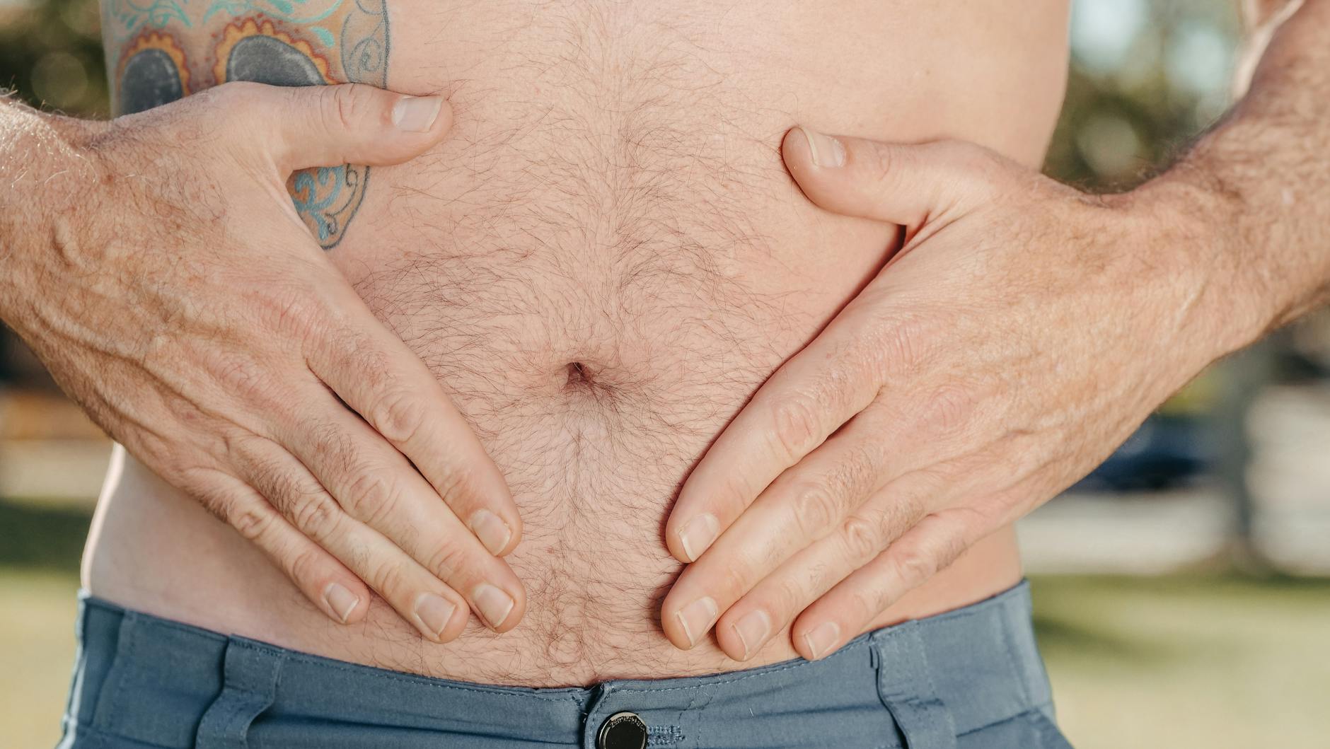 a person holding his stomach